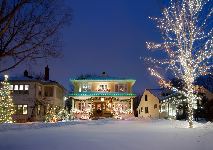 Christmas lights on a house and tree